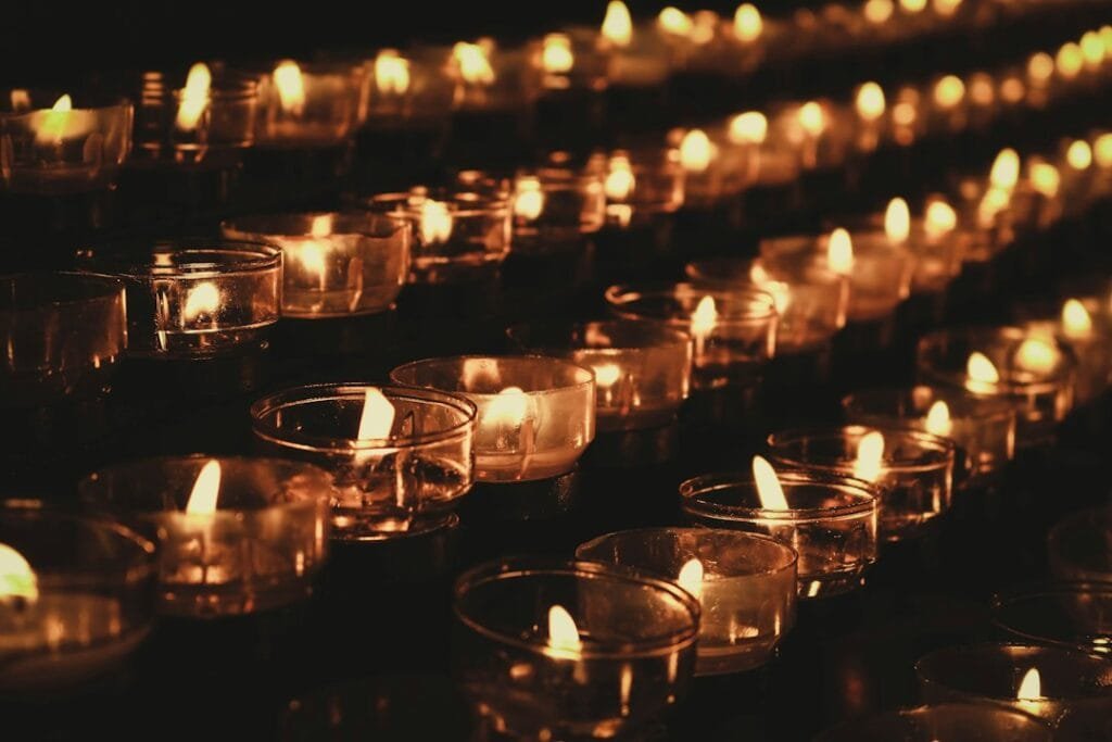 lit candles in a cemetery